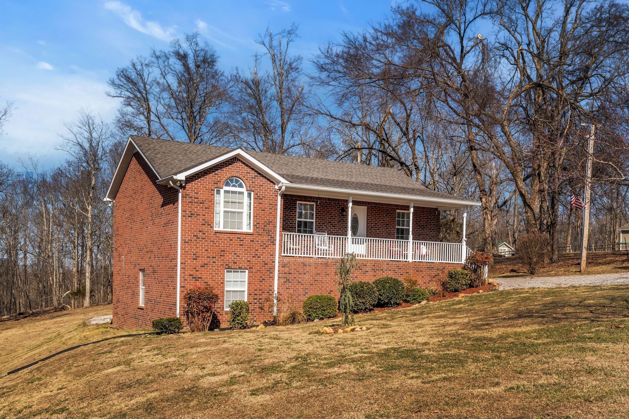 2450 Scotty Parker Road Portland, TN 37148 - Photo 3 of 37 a front view of a house with a yard
