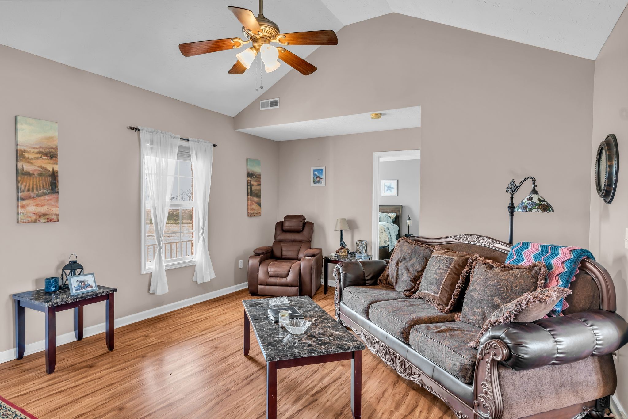 2450 Scotty Parker Road Portland, TN 37148 - Photo 7 of 37 a living room with furniture a rug and a window