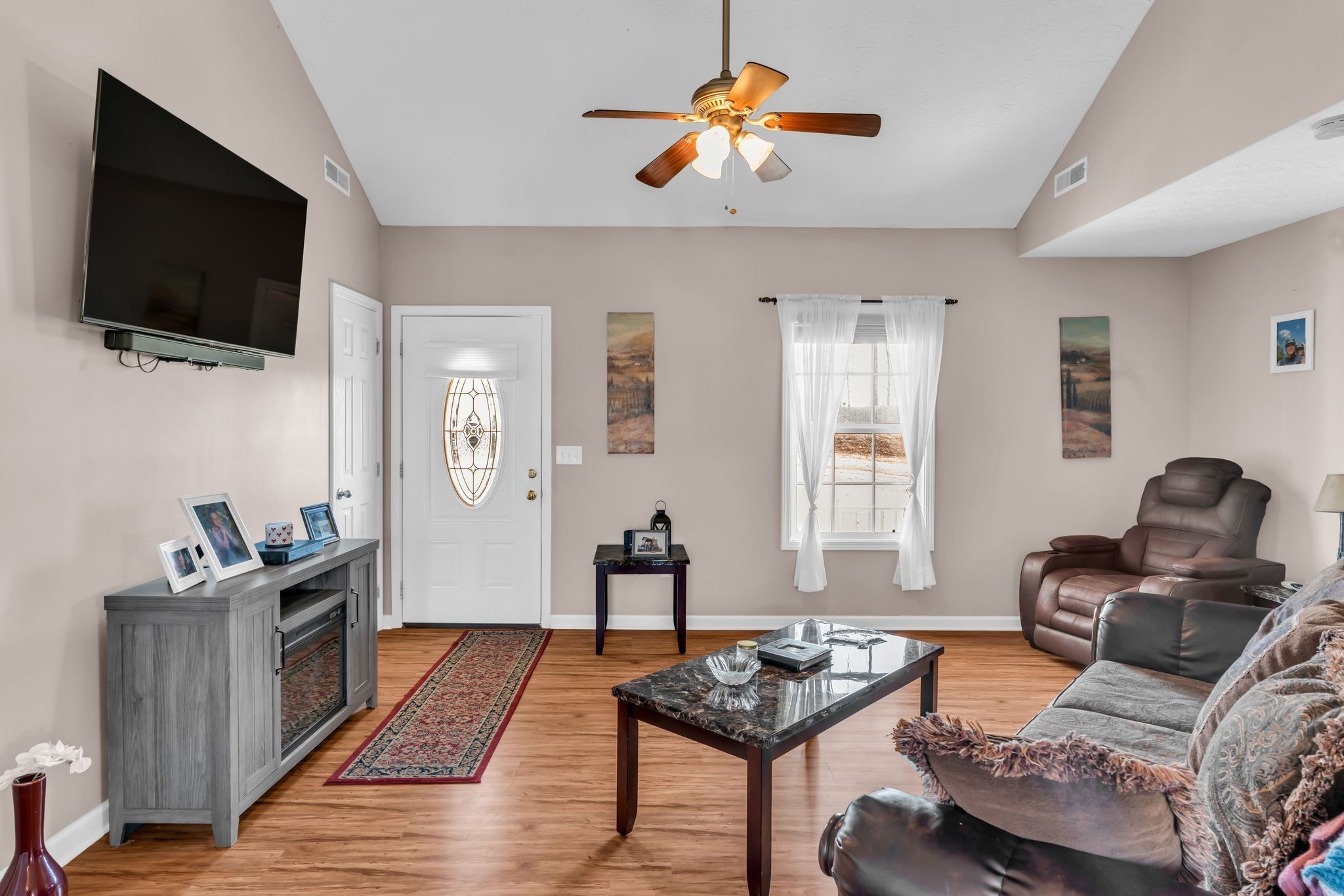2450 Scotty Parker Road Portland, TN 37148 - Photo 9 of 37 a living room with furniture and a flat screen tv
