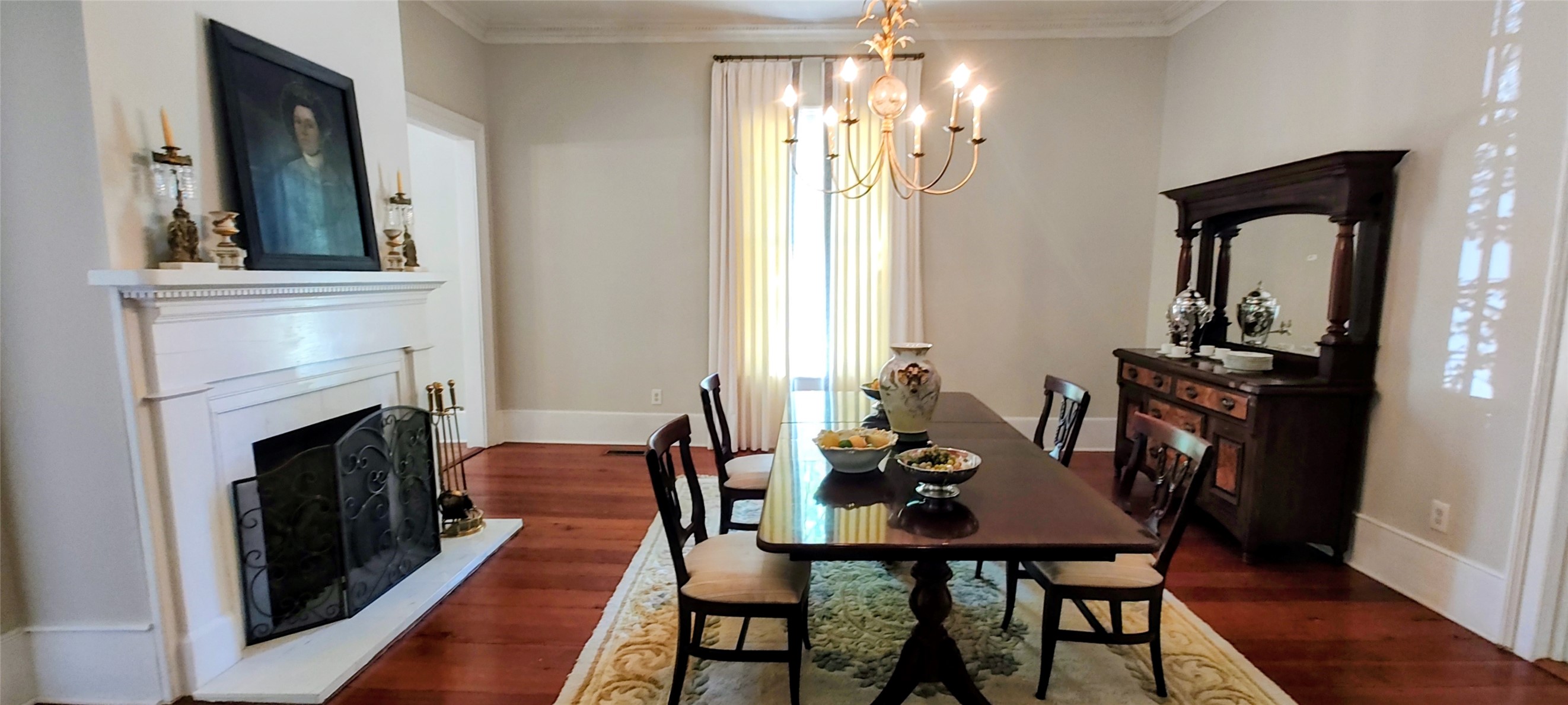 414 Spring Street Washington, GA 30673 - Photo 11 of 42 a view of a dining room with furniture and wooden floor
