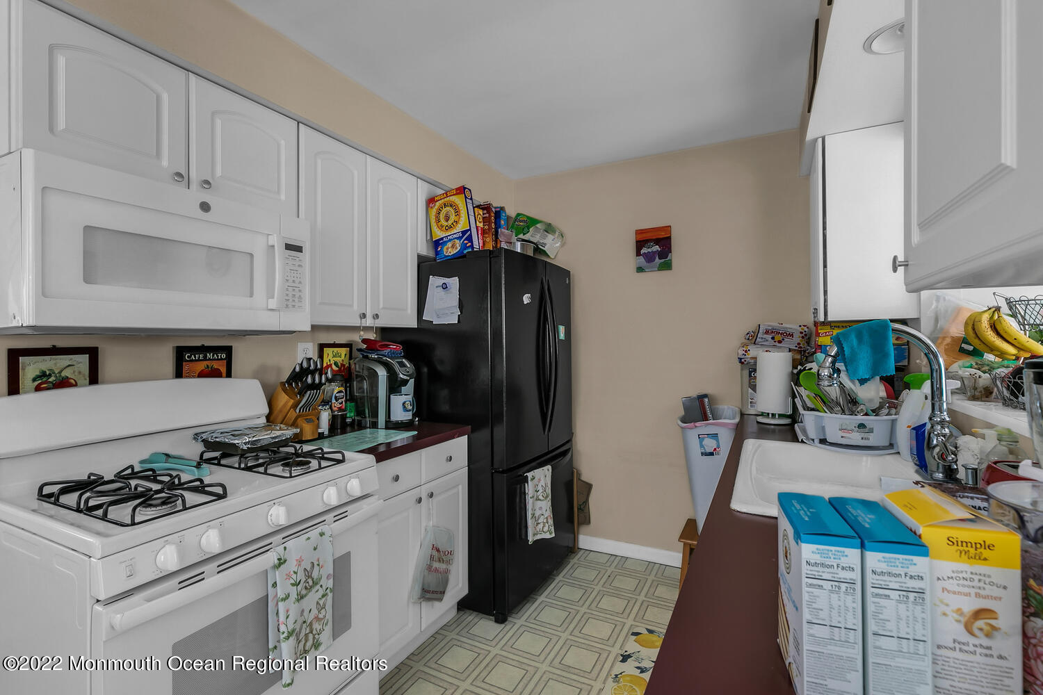 2314 Oak Tree Road Point Pleasant, NJ 08742 - Photo 11 of 17 a kitchen with stainless steel appliances granite countertop a sink stove and refrigerator