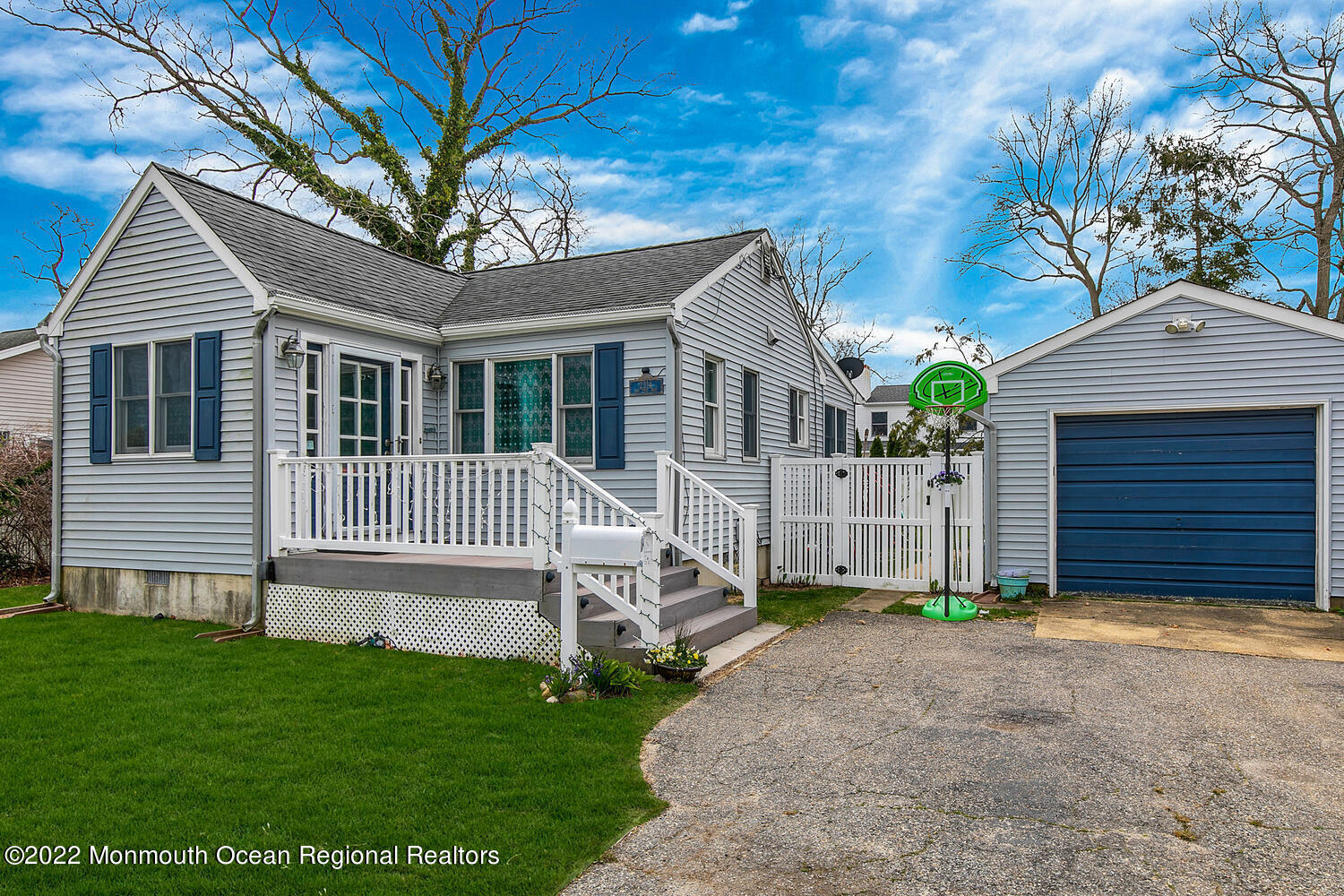2314 Oak Tree Road Point Pleasant, NJ 08742 - Photo 17 of 17 a front view of a house with a garden and yard