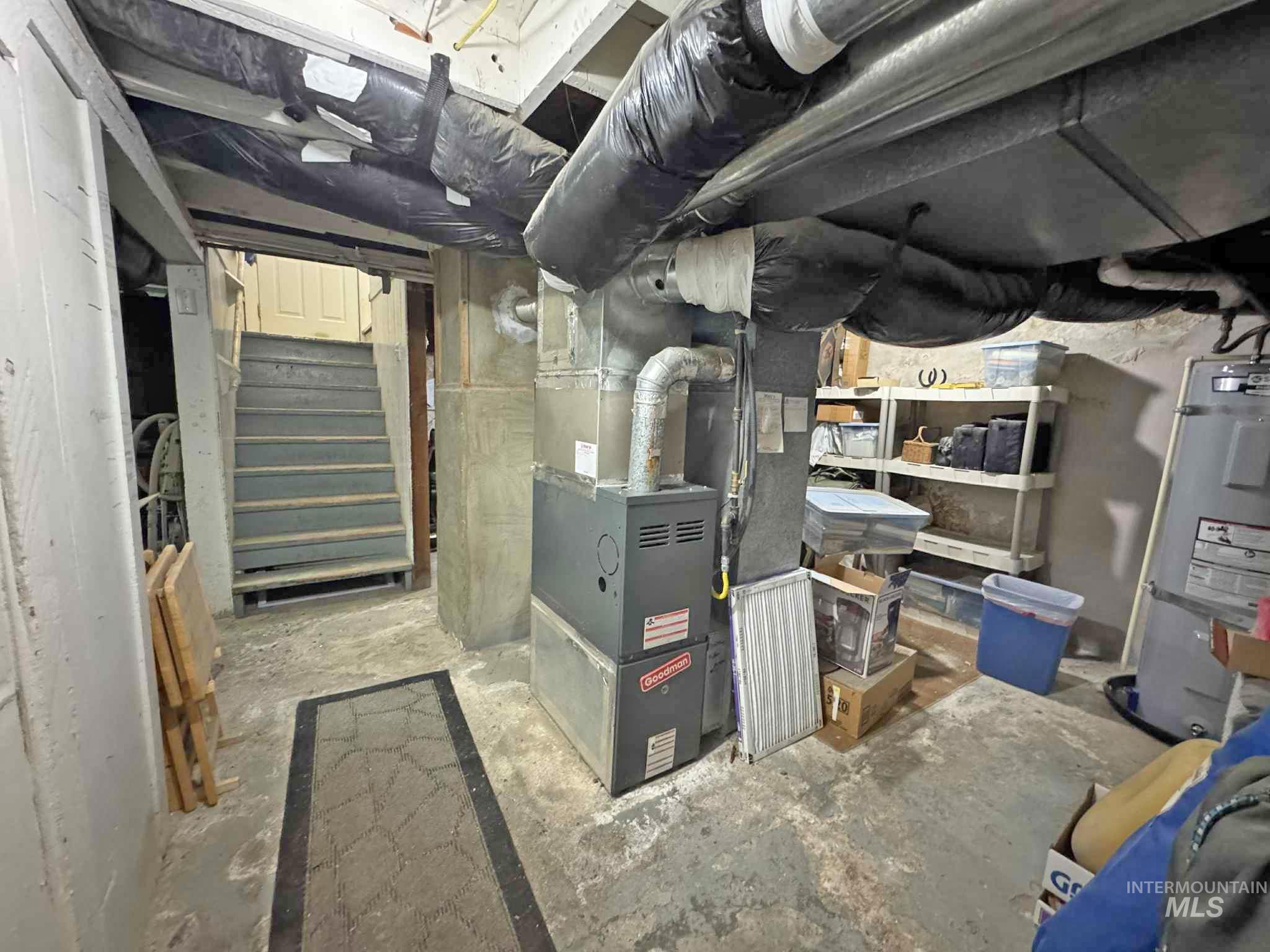 318 Maple Street Clarkston, WA 99403 - Photo 12 of 14 Utility room featuring water heater and heating unit