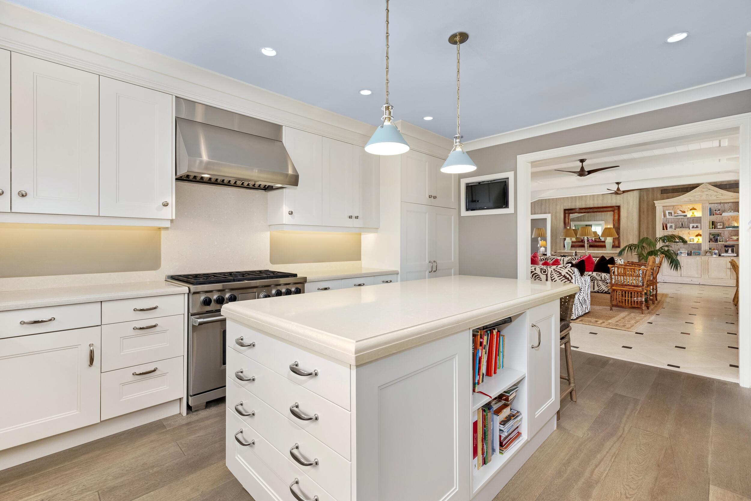 258 List Road Palm Beach, FL 33480 - Photo 17 of 49 a kitchen that has a lot of white cabinets and stainless steel appliances
