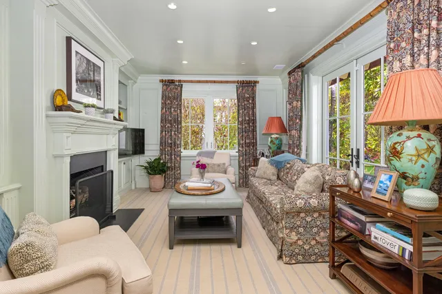 a spacious bathroom with double vanity sinks a large mirror and a bathtub