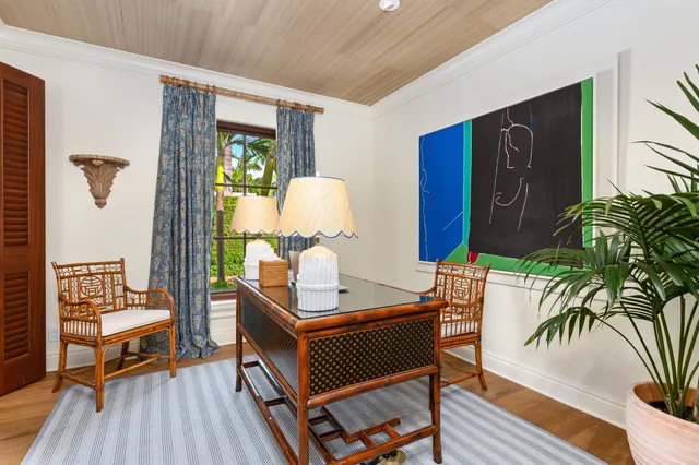 a bathroom with a granite countertop sink a toilet and a mirror