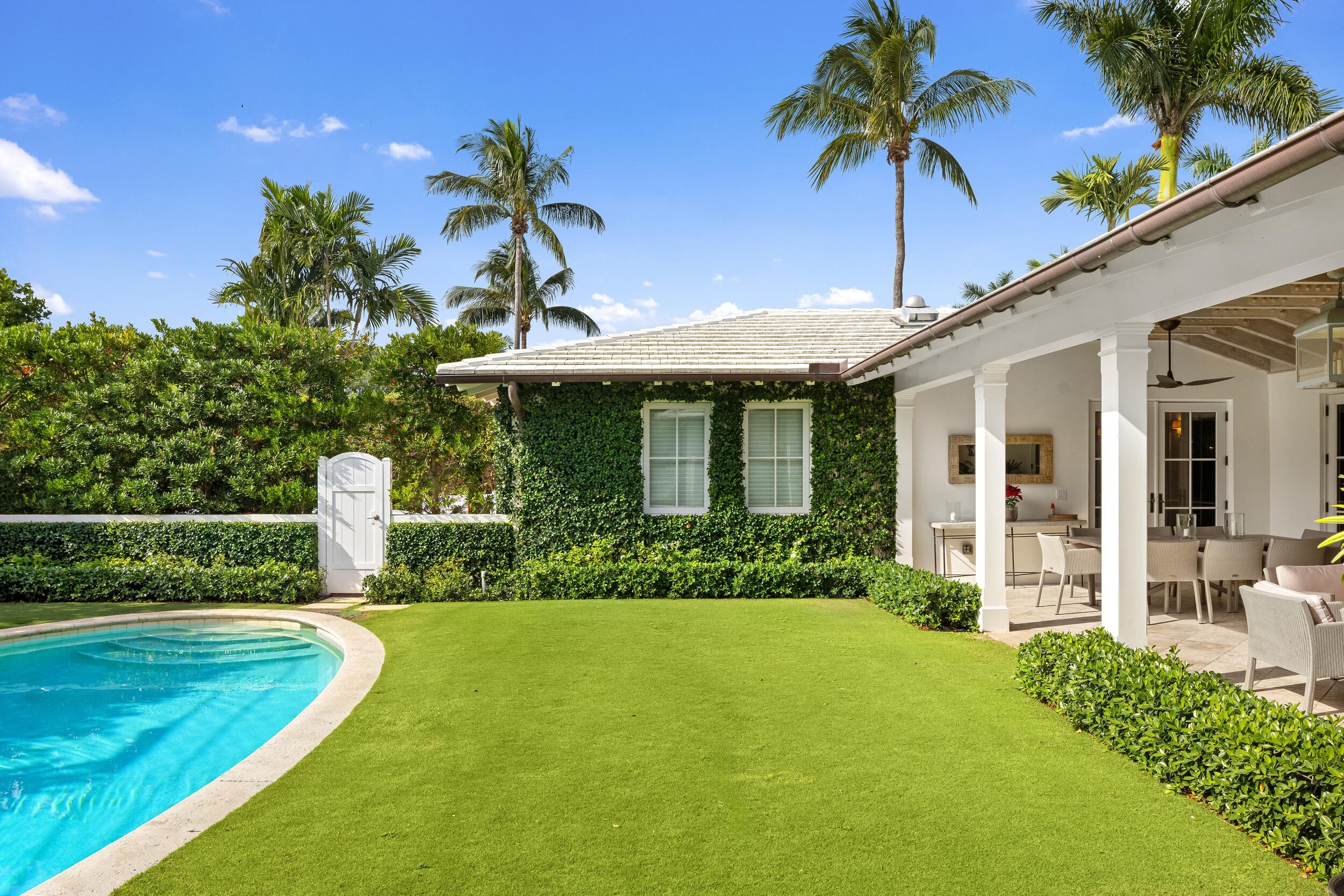 258 List Road Palm Beach, FL 33480 - Photo 43 of 49 a front view of a house with garden