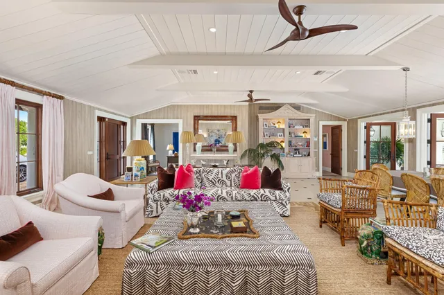 a bedroom with furniture and a chandelier