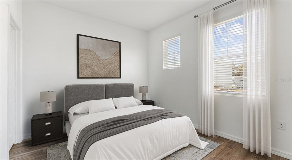 6499 Southwest 44th Street, Unit PINEHURST Gainesville, FL 32608 - Photo 9 of 19 a bedroom with a bed and a window