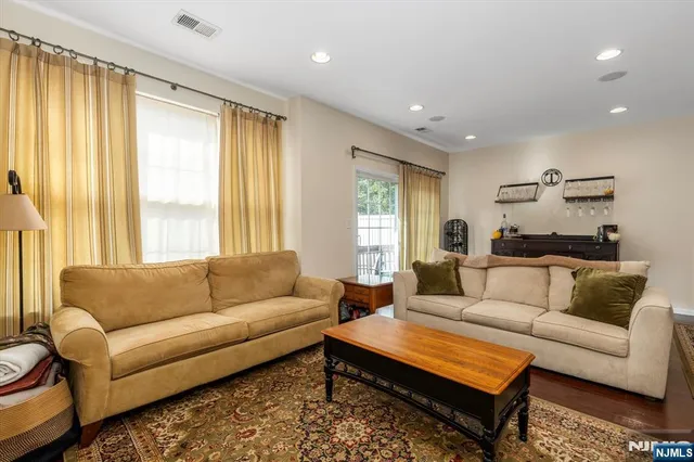a view of a room with wooden floor and shoes