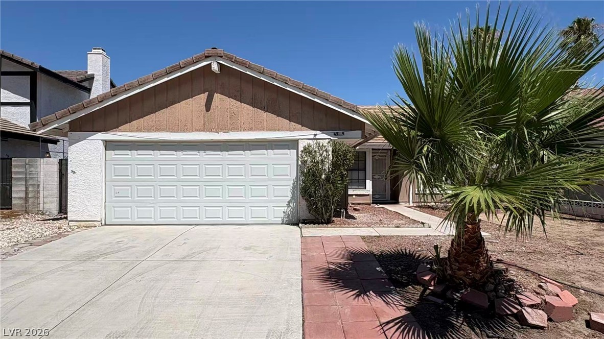 4325 Newcastle Road Las Vegas, NV 89103 - Photo 1 of 18 A well-maintained facade with a prominent two-car garage and a decorative palm tree defines this inviting home's curb appeal.