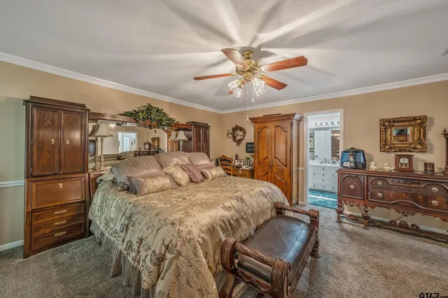 a bed room with a bed and a dresser