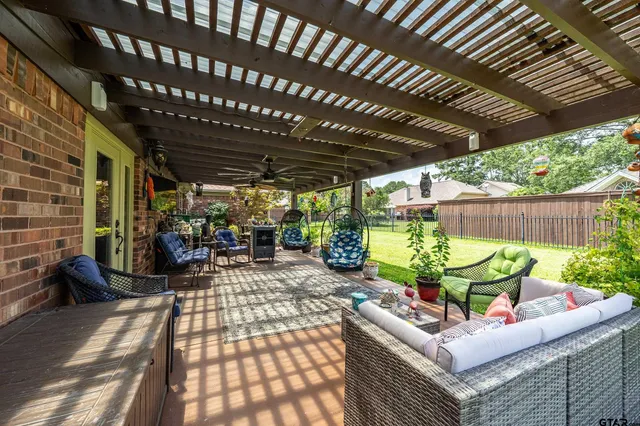 a view of an outdoor sitting area with furniture