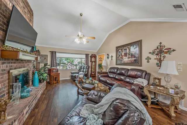 a living room with fireplace furniture and a fireplace