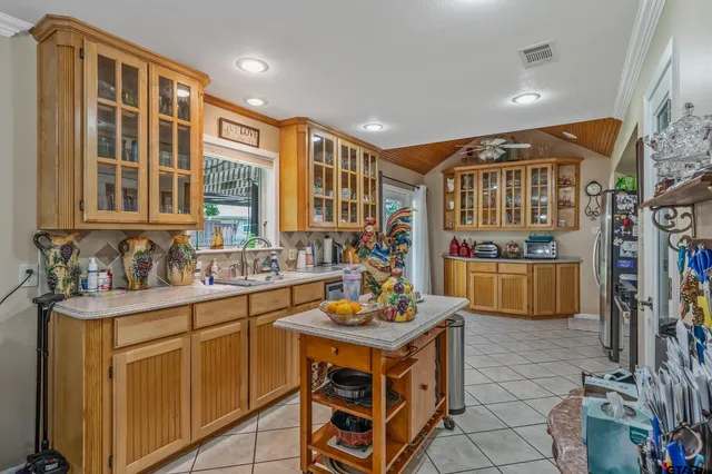 a kitchen with stainless steel appliances granite countertop a stove and a sink
