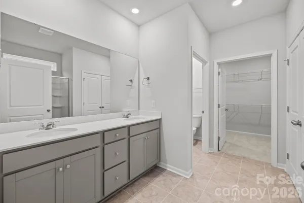 a bathroom with a shower and a sink