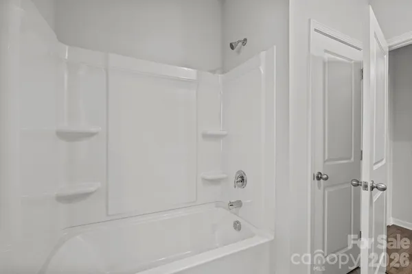 a view of empty room with windows