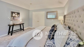 2509 201st Street Southeast Bothell, WA 98021 - Photo 14 of 33 a bedroom with a bed and a painting on the wall