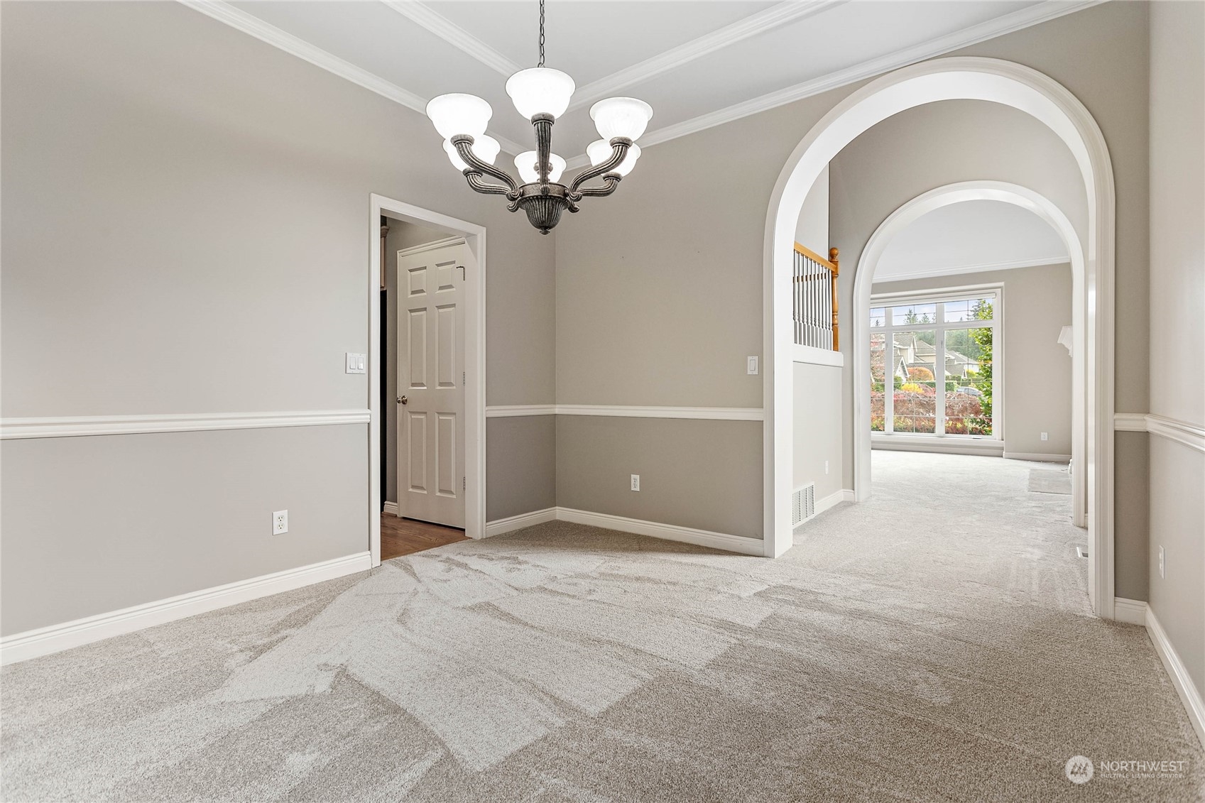 2509 201st Street Southeast Bothell, WA 98021 - Photo 19 of 33 a view of a livingroom with a large window and chandelier