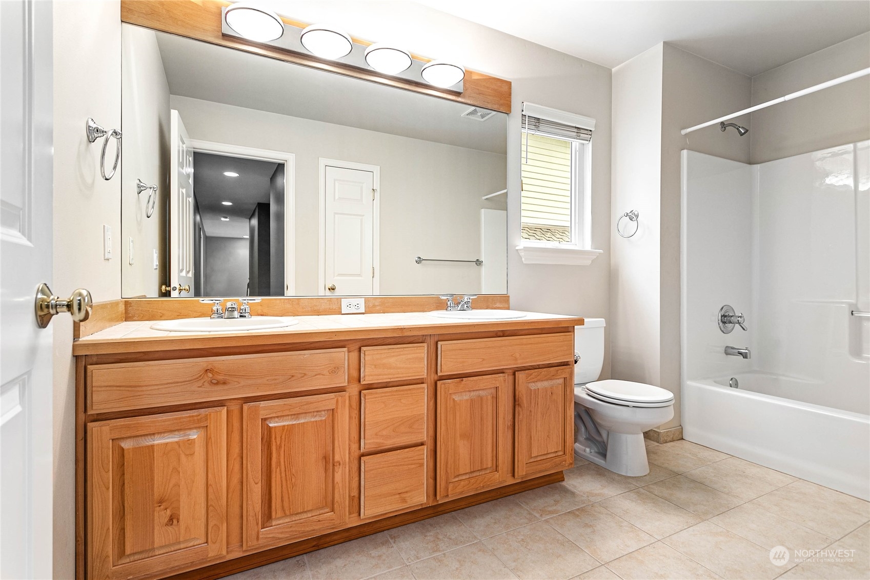 2509 201st Street Southeast Bothell, WA 98021 - Photo 29 of 33 a bathroom with a double vanity sink a toilet and a bathtub