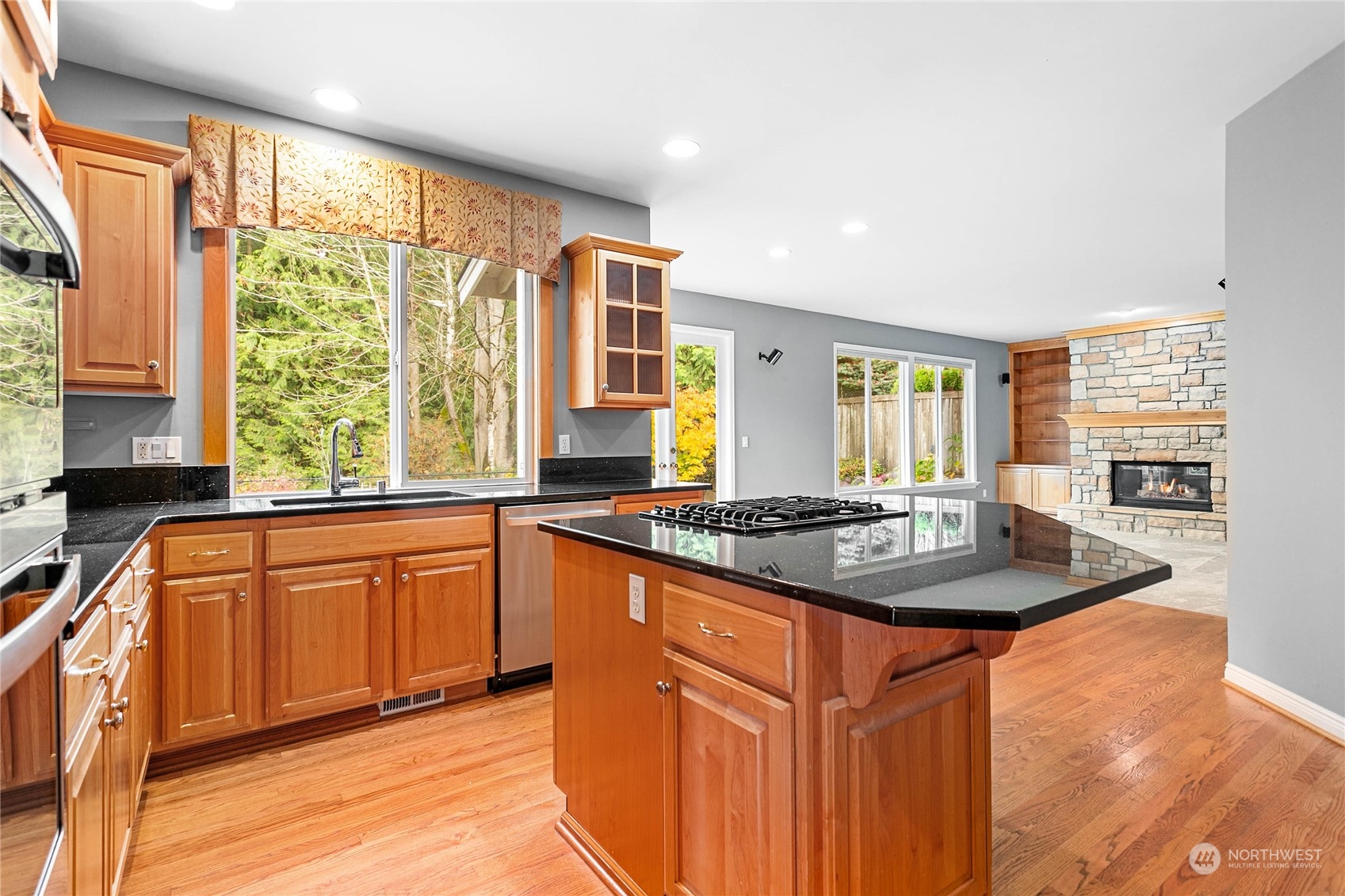 2509 201st Street Southeast Bothell, WA 98021 - Photo 5 of 33 a kitchen with stainless steel appliances granite countertop a stove a sink and a refrigerator