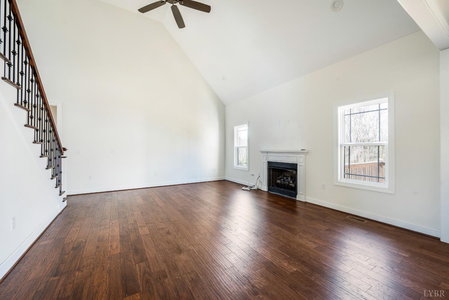 1089 Elk Creek Road Forest, VA 24551 - Photo 19 of 67 an empty room with floor to ceiling windows and fireplace