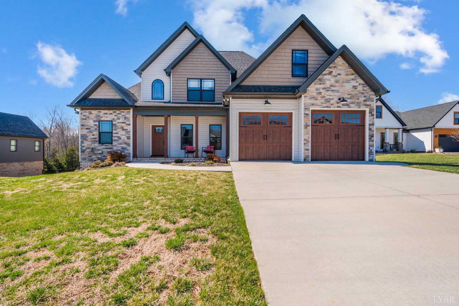 1089 Elk Creek Road Forest, VA 24551 - Photo 3 of 67 a front view of a house with a yard and garage