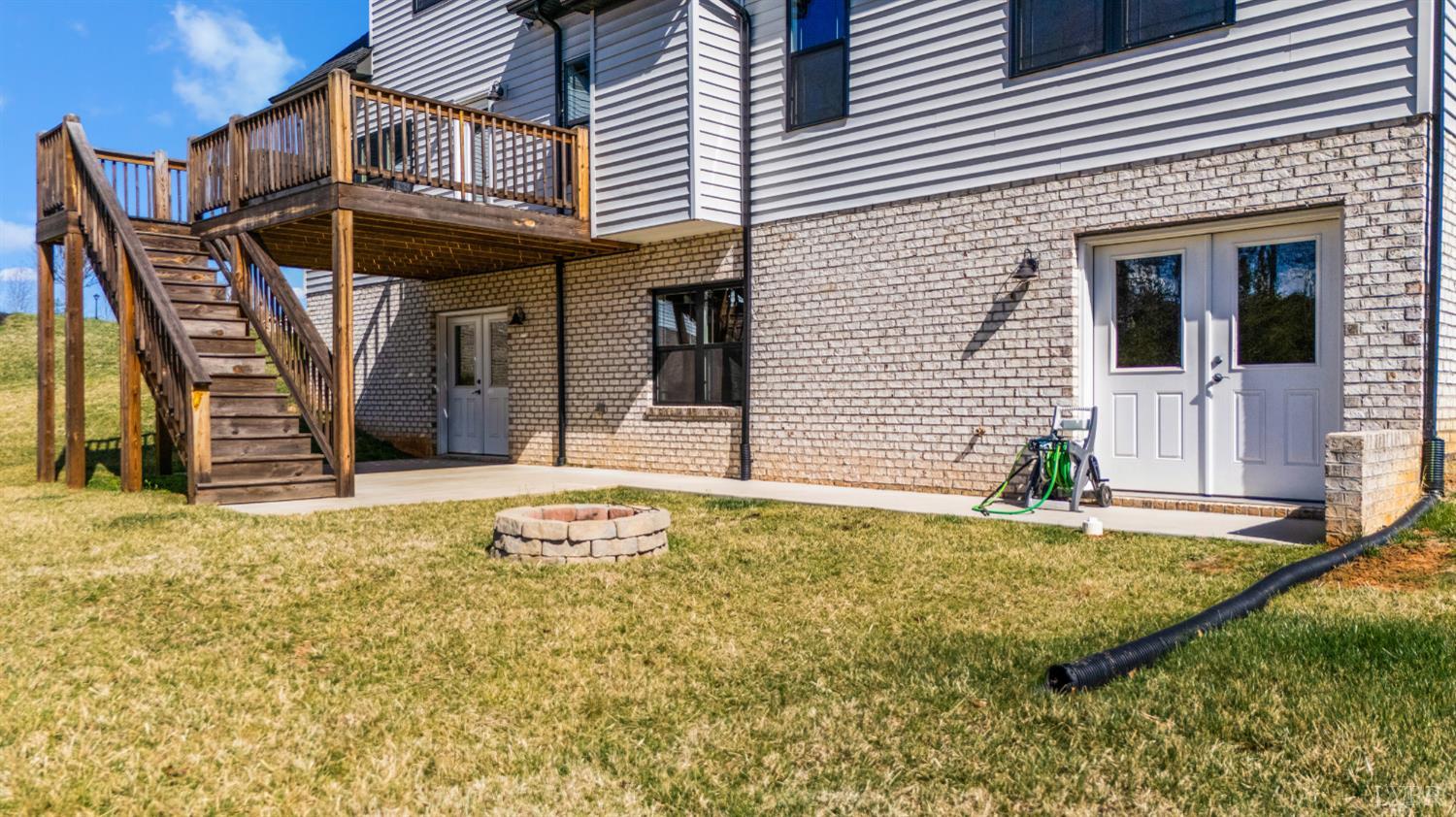 1089 Elk Creek Road Forest, VA 24551 - Photo 10 of 67 a view of a house with floor to ceiling windows and wooden fence