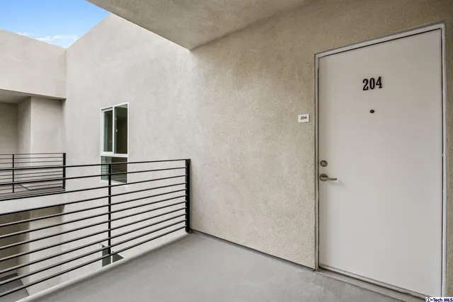 a view of kitchen with stove and cabinets