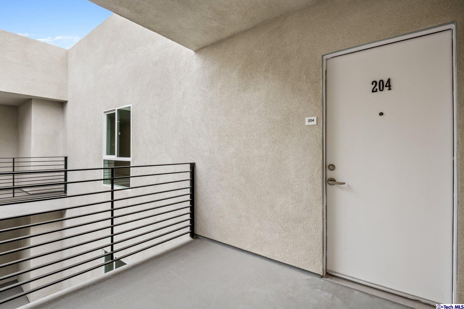 7064 Greeley Street, Unit 204 Tujunga, CA 91042 - Photo 15 of 39 a view of a hallway with closet
