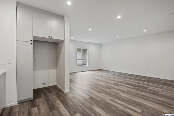 a kitchen with a sink and stainless steel appliances