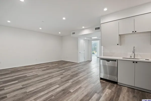 a bathroom with a shower a toilet and a sink