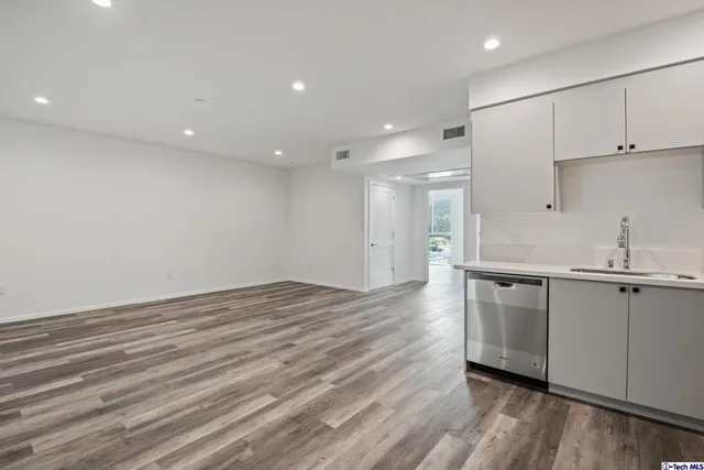 a bathroom with a shower a toilet and a sink