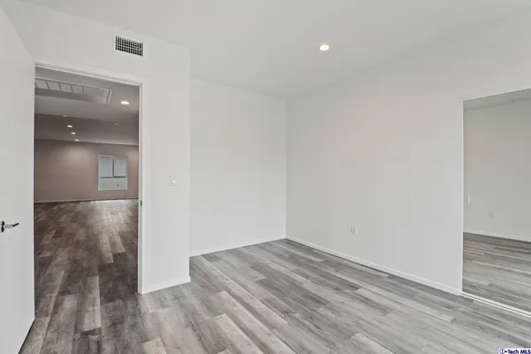 a view of a street with a building in the background