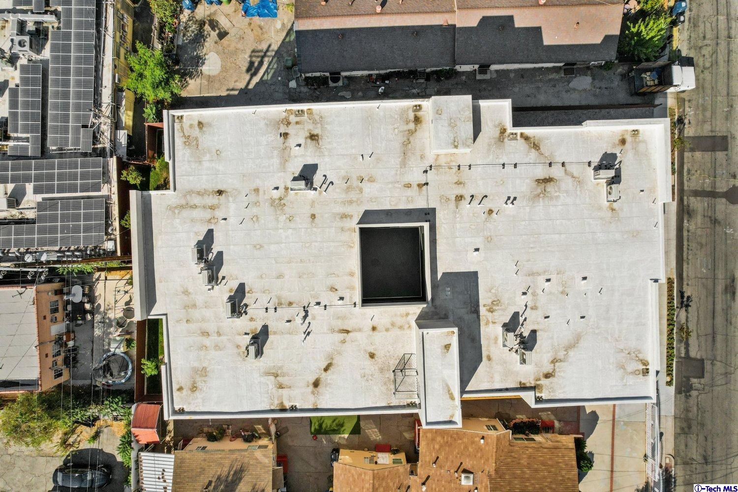7064 Greeley Street, Unit 204 Tujunga, CA 91042 - Photo 38 of 39 an aerial view of residential houses with outdoor space