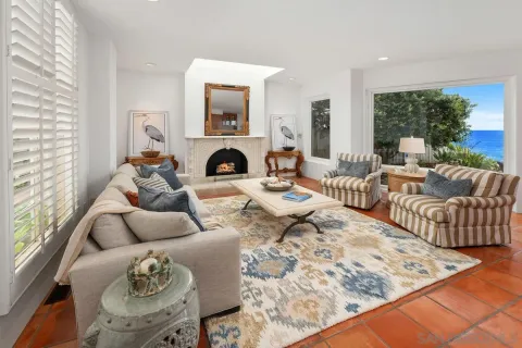 a view of a living room kitchen and a sink