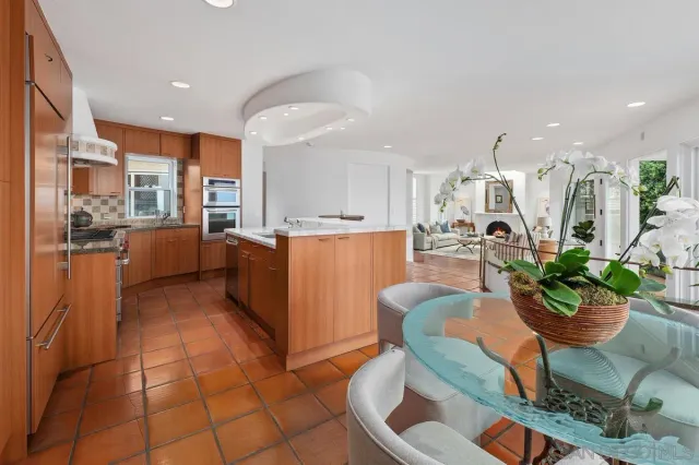a living room with furniture cabinets and window
