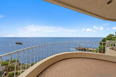 a bathroom with a tub a sink and a large window