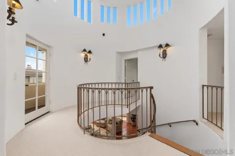 a bathroom with a granite countertop toilet sink and mirror