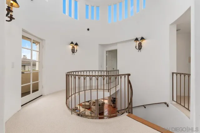 a bathroom with a granite countertop toilet sink and mirror
