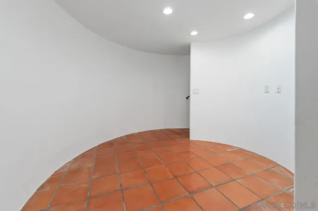 a front view of a house with yard and outdoor seating