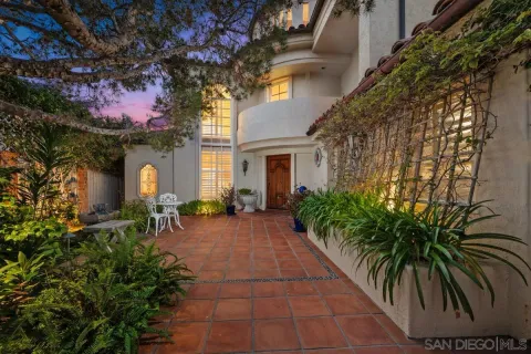a view of a living room and a large window
