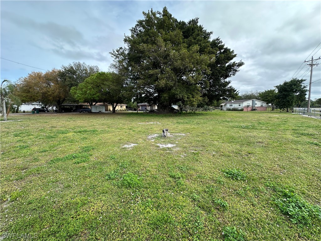 2404 Lake Trafford Road Immokalee, FL 34142 - Photo 1 of 9 a backyard of a house with lots of green space
