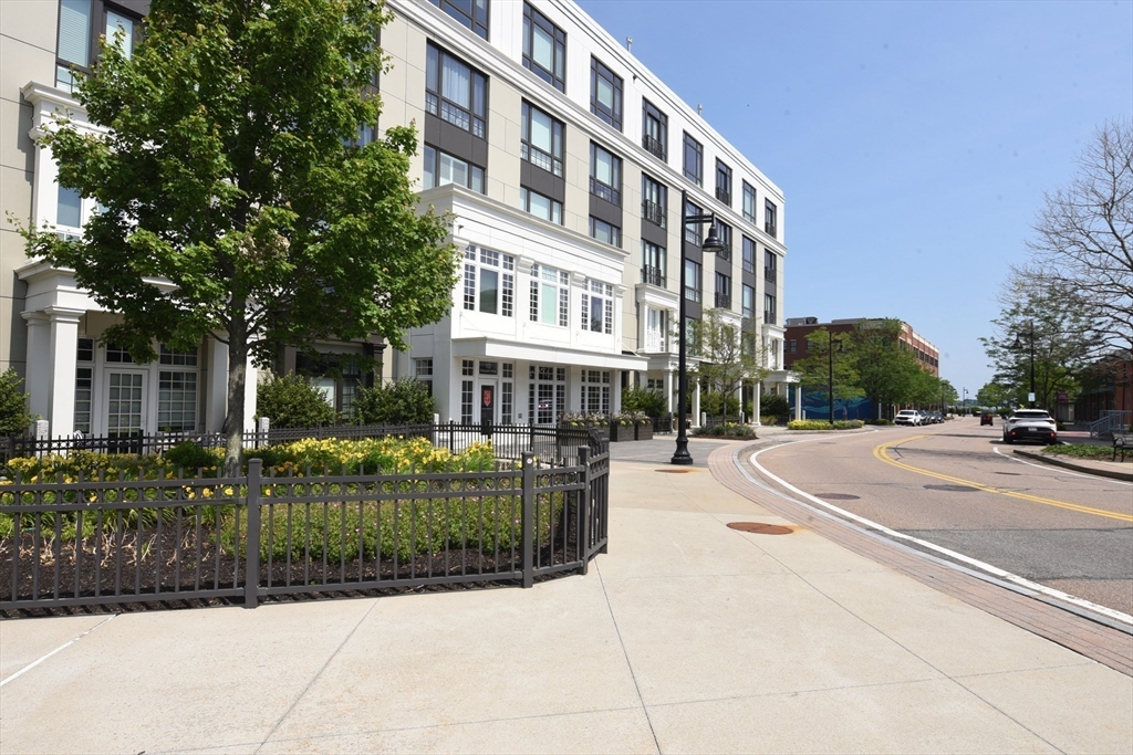 a view of a building with a yard