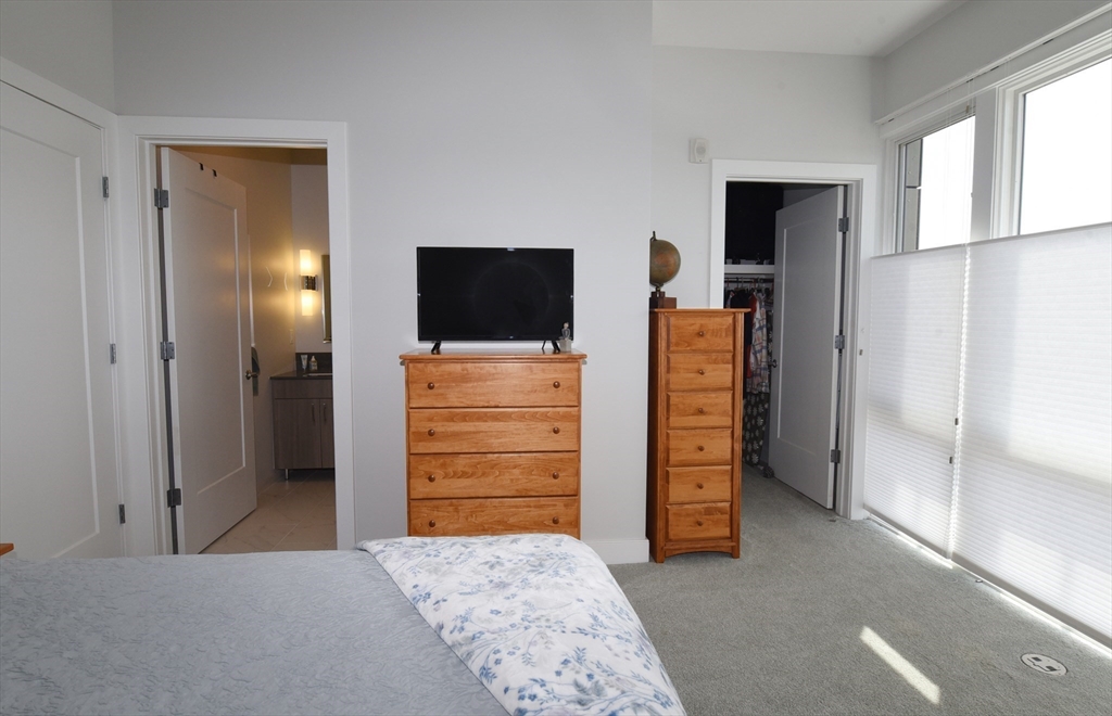 10 Shipyard Drive, Unit 313 Hingham, MA 02043 - Photo 21 of 39 a view of walk in closet with furniture and a window