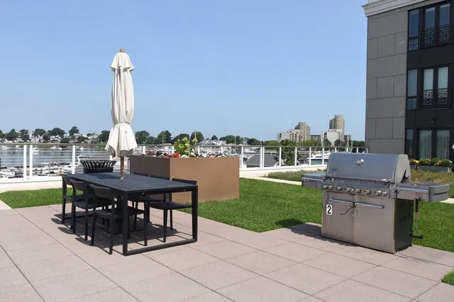 a view of a patio with a table and chairs