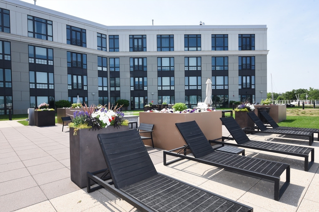 10 Shipyard Drive, Unit 313 Hingham, MA 02043 - Photo 30 of 39 a view of a patio filled with furniture