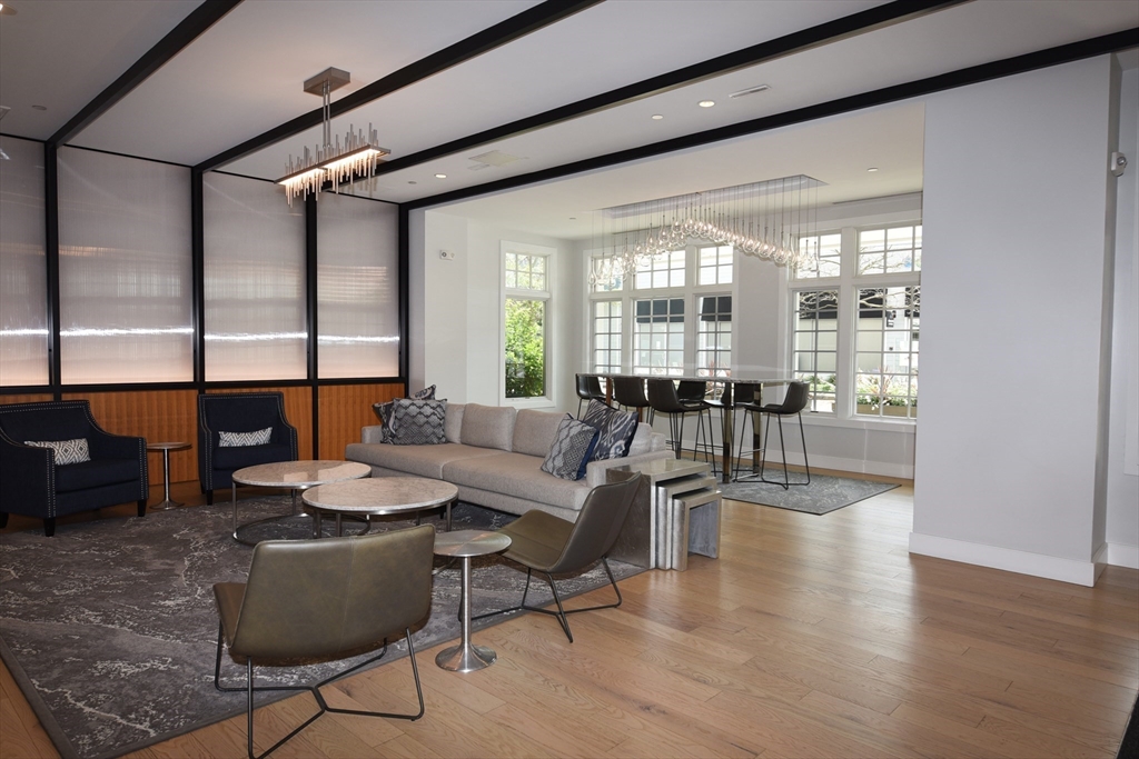 10 Shipyard Drive, Unit 313 Hingham, MA 02043 - Photo 31 of 39 a living room with furniture and a large window