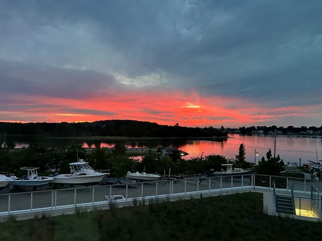 a view of a lake with houses in the back