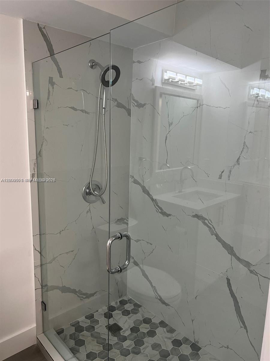 931 Lyons Road, Unit 4101 Coconut Creek, FL 33063 - Photo 8 of 23 a bathroom with a shower